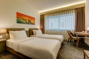 Ένα ή περισσότερα κρεβάτια σε δωμάτιο στο Plus Hotel Bostanci Atasehir