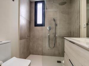 a bathroom with a shower with a toilet and a sink at Villas Alamos - 4509 in Mar de Cristal +23 photos