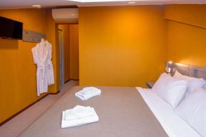 Кровать или кровати в номере Kindli Hotel