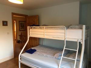 a couple of bunk beds in a room at 7B Riverside Villas in Kenmare