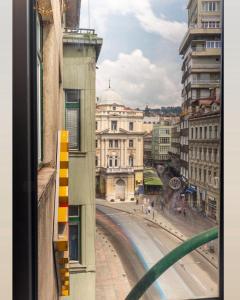 a view of a city street from a window at Apartmoon in Sarajevo
