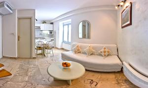 a living room with a couch and a table at Villa Šoulavy in Kaštela