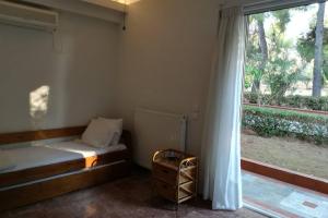 Postel nebo postele na pokoji v ubytování Pine tree beachfront villa