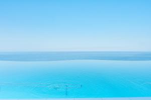 a blue ocean with a clear blue sky at Gloria Palace Amadores Thalasso & Hotel in Puerto Rico de Gran Canaria