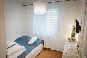 Posteľ alebo postele v izbe v ubytovaní Apartament Witkiewicza Sanok
