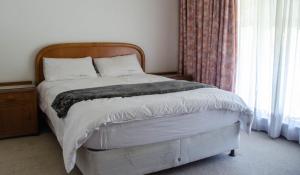 Postel nebo postele na pokoji v ubytování Simunye Guest House
