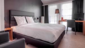 Voodi või voodid majutusasutuse Hotel St James toas