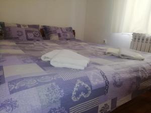 מיטה או מיטות בחדר ב-Apartment Green Free private parking