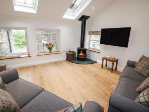 a living room with a couch and a fire place at Norton in Keswick