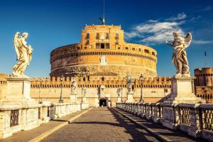 a building with two statues on a bridge at Da Adriana al vaticano in Rome