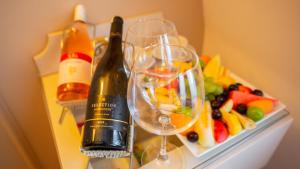 a bottle of wine and two glasses on a table at Orient Express & Spa by Orka Hotels in Istanbul