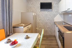 A kitchen or kitchenette at BOLERO Suites