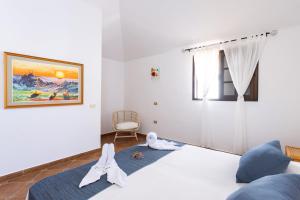 Ліжко або ліжка в номері Casa Limon - Ocean View - BBQ - Garden - Terrace - Free Wifi - Child & Pet-Friendly - 2 bedrooms - 6 people