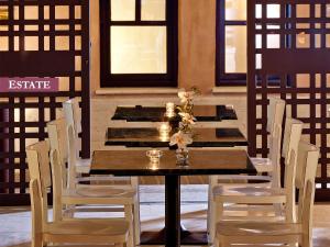 
a dining room table with chairs and tables at Rimondi Boutique Hotel - Small Luxury Hotels of the World in Rethymno Town
