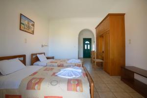 Postel nebo postele na pokoji v ubytování Theodosia Hotel