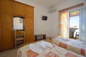 Postel nebo postele na pokoji v ubytování Theodosia Hotel