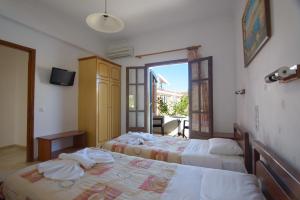 Postel nebo postele na pokoji v ubytování Theodosia Hotel