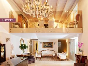 a large living room with a chandelier at Rimondi Boutique Hotel - Small Luxury Hotels of the World in Rethymno