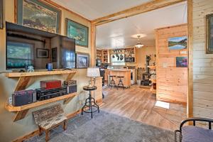 a log home with a living room and a kitchen at High Lakes Hideaway La Pine Fishing Cabin! in La Pine