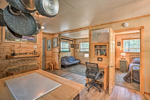 a home office with a desk and a bedroom at High Lakes Hideaway La Pine Fishing Cabin! in La Pine