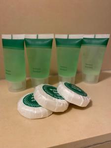 a group of four plastic cups sitting on a table at Winnica Nawrot in Mechelinki