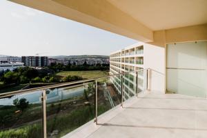 a balcony with a view of a building at Homeland Apartments VIVA in Cluj-Napoca
