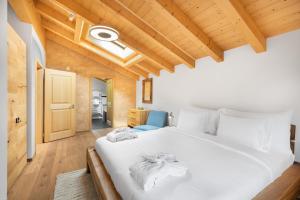 Kama o mga kama sa kuwarto sa Chalet Alia and Apartments-Grindelwald by Swiss Hotel Apartments