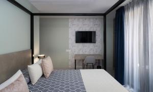 Кровать или кровати в номере Hotel Perla del Sur