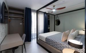 Кровать или кровати в номере Hotel Perla del Sur