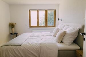 A bed or beds in a room at Bacherlhaus