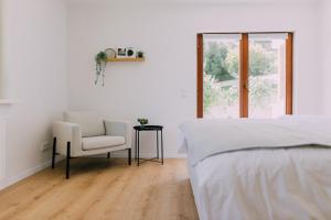 A bed or beds in a room at Bacherlhaus