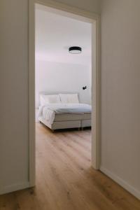 A bed or beds in a room at Bacherlhaus