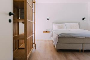 A bed or beds in a room at Bacherlhaus