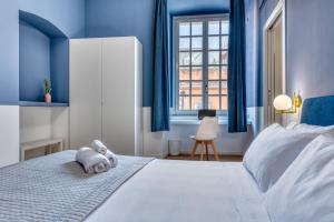 Postel nebo postele na pokoji v ubytování IzzHome Corso76