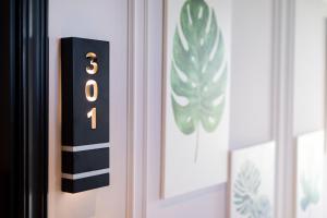 a door with a black and gold door knocker at Motif Hotel Çeşme in Çeşme
