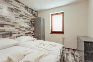 A bed or beds in a room at Chaty Panoráma