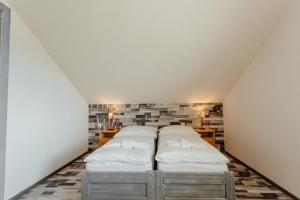 A bed or beds in a room at Chaty Panoráma