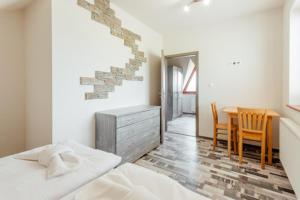 A bed or beds in a room at Chaty Panoráma