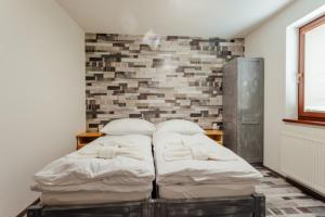 Posteľ alebo postele v izbe v ubytovaní Chaty Panoráma
