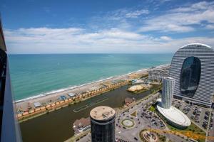 an aerial view of a city with the ocean at Batumi Orbi City sea view in Batumi