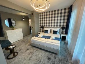Łóżko lub łóżka w pokoju w obiekcie Hotel Sanova