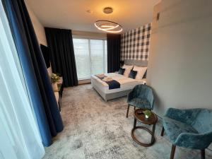 Łóżko lub łóżka w pokoju w obiekcie Hotel Sanova