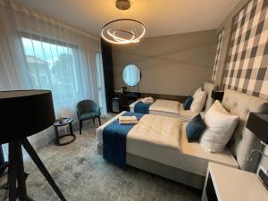 Łóżko lub łóżka w pokoju w obiekcie Hotel Sanova
