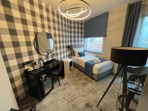 Łóżko lub łóżka w pokoju w obiekcie Hotel Sanova