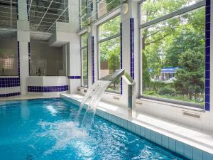 Bazén v ubytovaní VacationClub - Olymp Apartment 502A alebo v jeho blízkosti