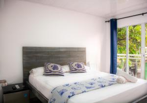 Postel nebo postele na pokoji v ubytování Hotel Nauticus