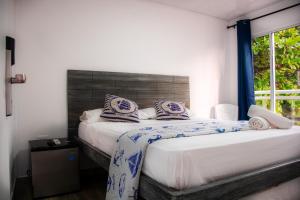 Postel nebo postele na pokoji v ubytování Hotel Nauticus