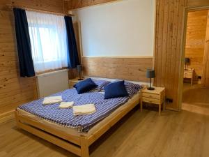 Postel nebo postele na pokoji v ubytování Penzion a Restaurace Vyhlídka