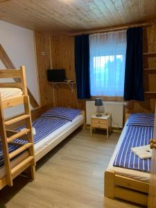 Postel nebo postele na pokoji v ubytování Penzion a Restaurace Vyhlídka