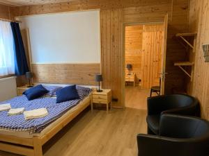 Postel nebo postele na pokoji v ubytování Penzion a Restaurace Vyhlídka
